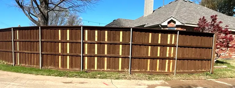 Tall cedar privacy fence on a Dallas–Fort Worth street